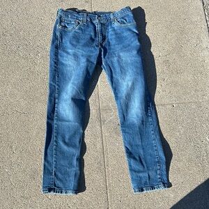 Blue Slim Jeans with Medium Wash and Visible Stitching